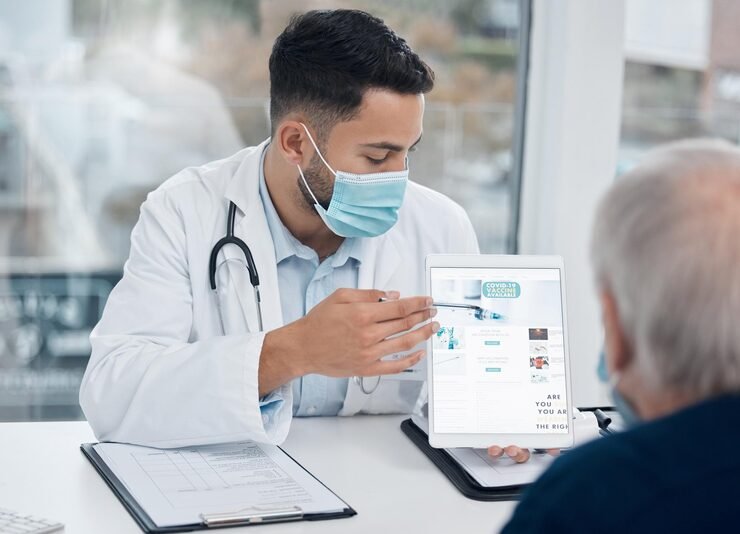 doctor man tablet with mask office healthcare information consulting clinic with patient professional male person medical advice technology hospital virus protection 590464 354403